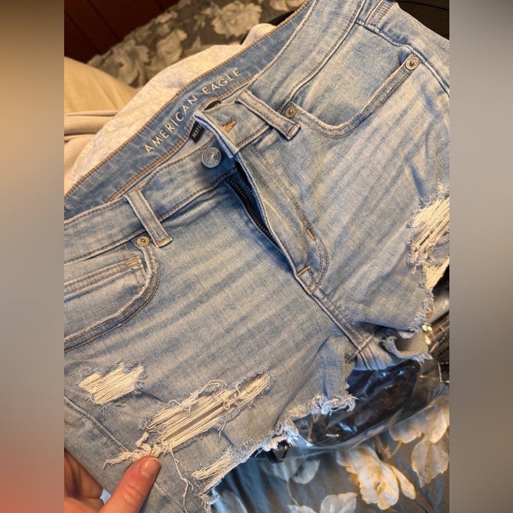 American Eagle Light Blue Denim with Tan Stitching